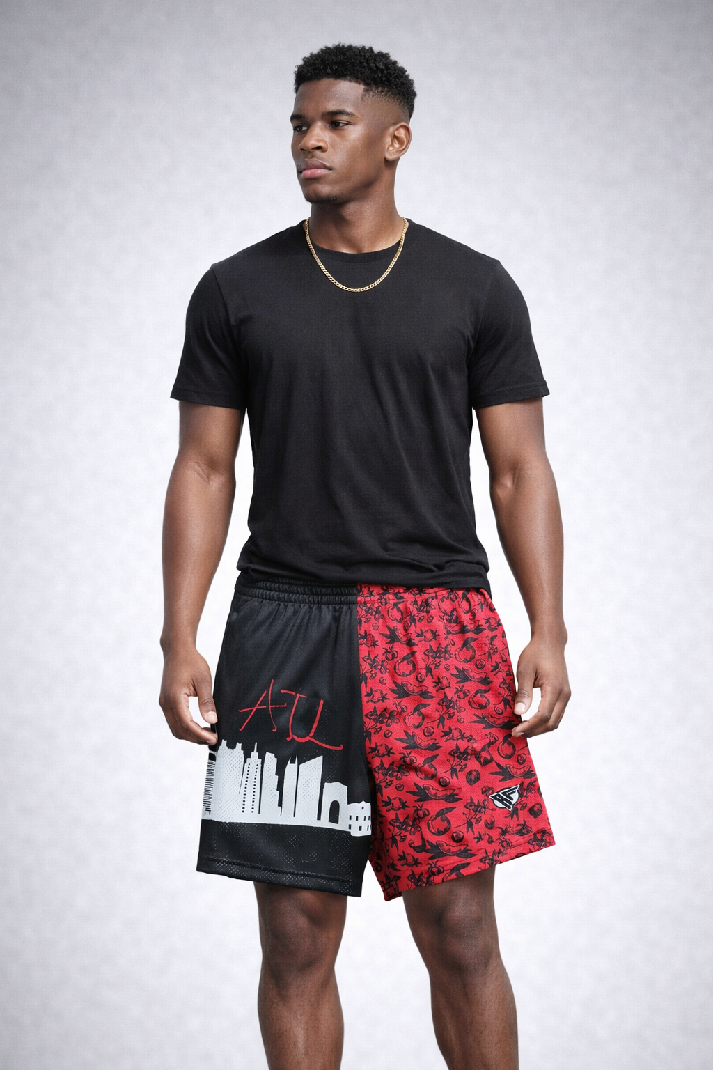 Man wearing a black t-shirt and RF-Wear Men's Mesh Atlanta Cityscape Shorts in  Black/Red