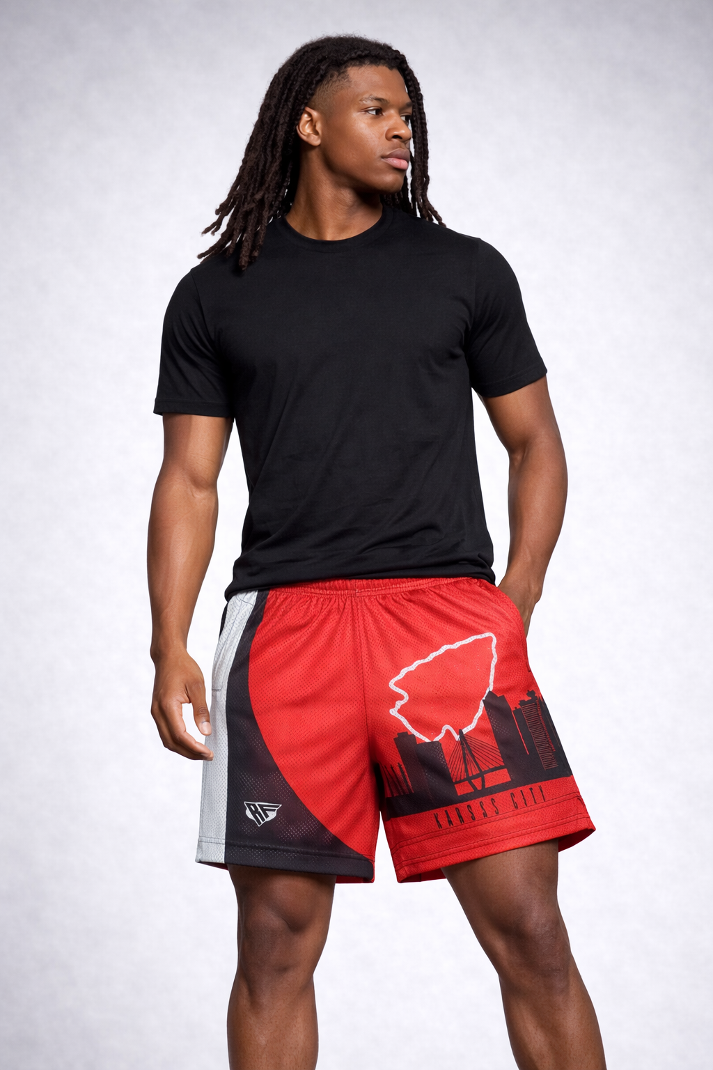 Man wearing a black short sleeve top and RF-Wear Men's Mesh Kansas City Cityscape Shorts in  Black/Red