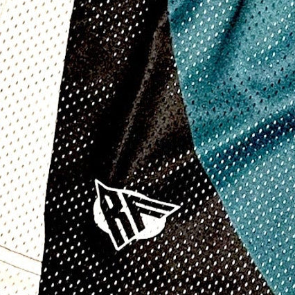Close-up of RF-Wear Men's Mesh Philadelphia Cityscape Shorts in Green/Black with RF logo