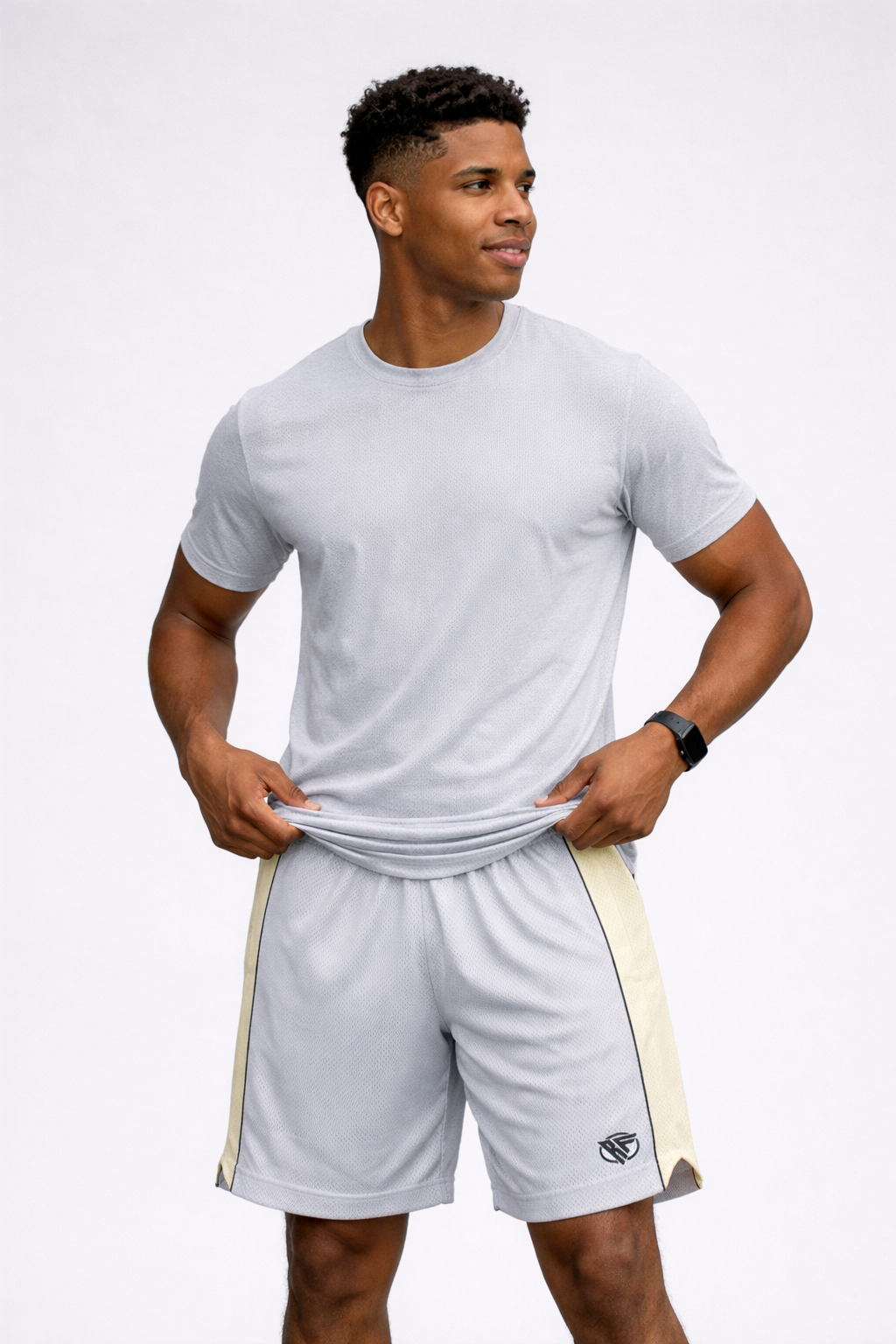 Man wearing a t-shirt and RF-Wear Men's Mesh Cream Stripe V-Cut Shorts in Grey