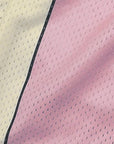 Close-up of RF-Wear Men's Mesh Cream Stripe V-Cut Shorts in Pink
