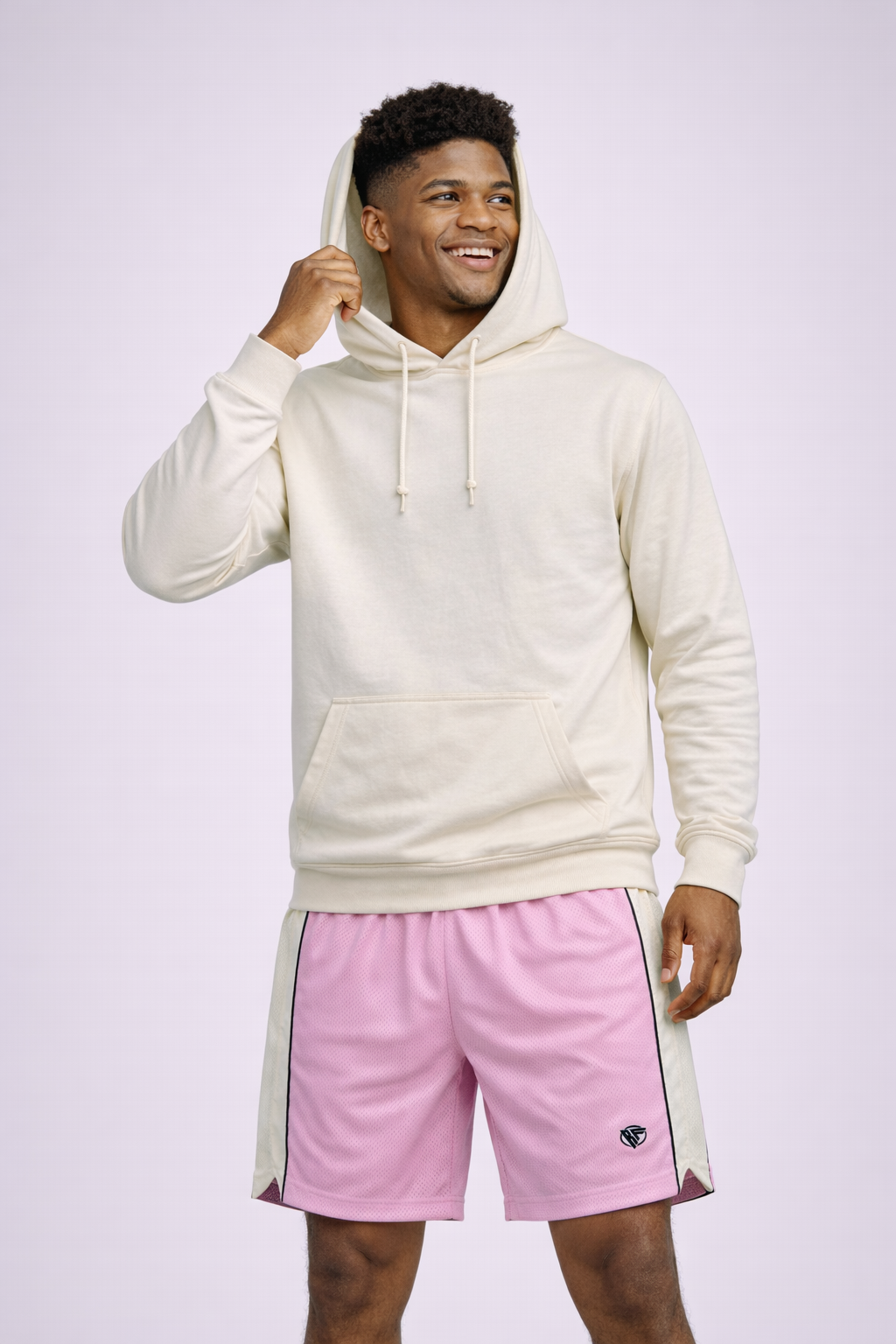 Man wearing a white hoodie with RF-Wear Men's Mesh Cream Stripe V-Cut Shorts in Pink