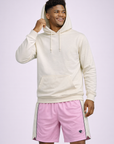 Man wearing a white hoodie with RF-Wear Men's Mesh Cream Stripe V-Cut Shorts in Pink