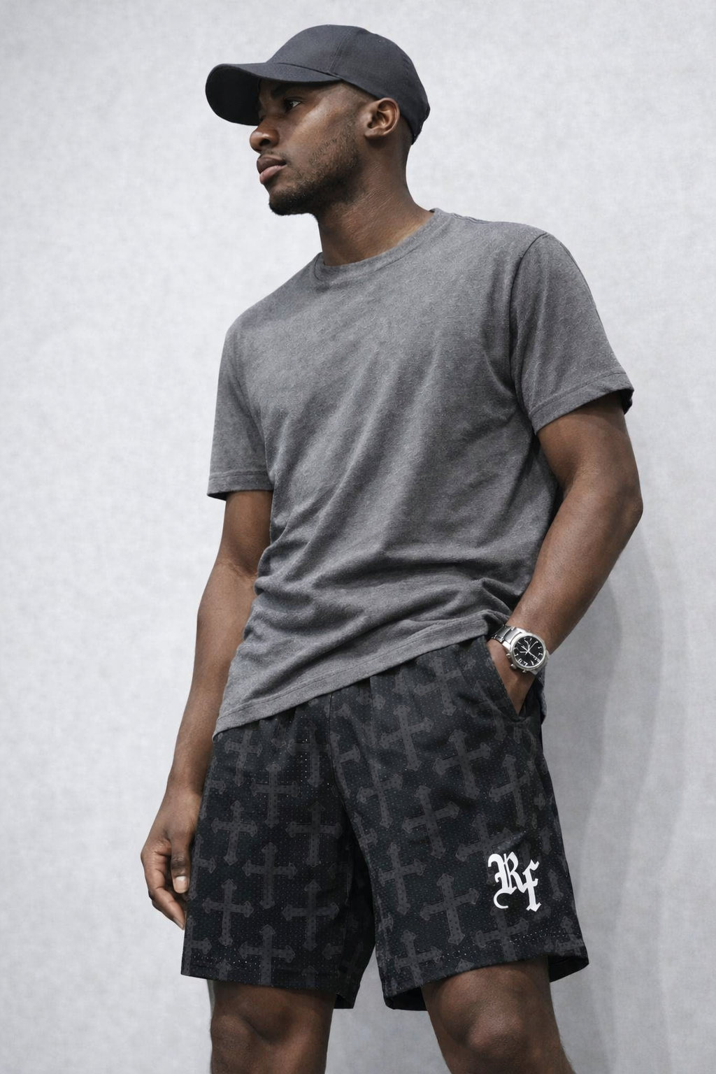 Man wearing RF-Wear Men's Mesh Cross 2.0 Shorts in Black