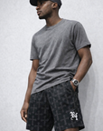 Man wearing RF-Wear Men's Mesh Cross 2.0 Shorts in Black