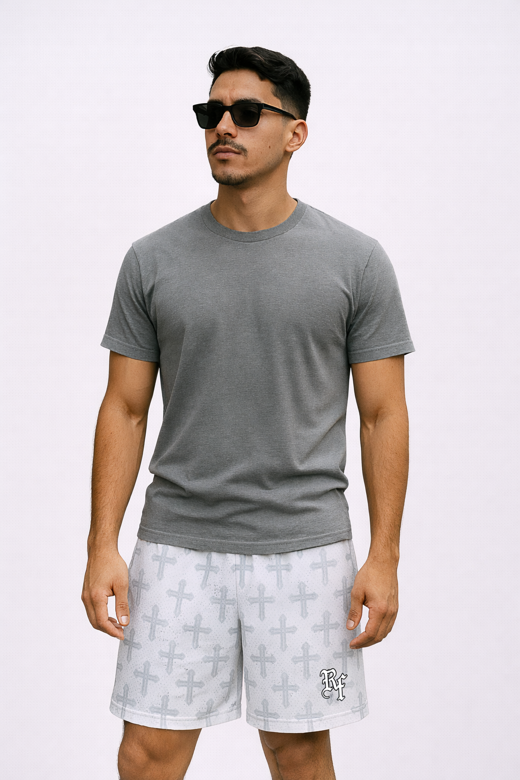 Man wearing a grey t-shirt and RF-Wear Men's Mesh Cross 2.0 Shorts in White/Grey 