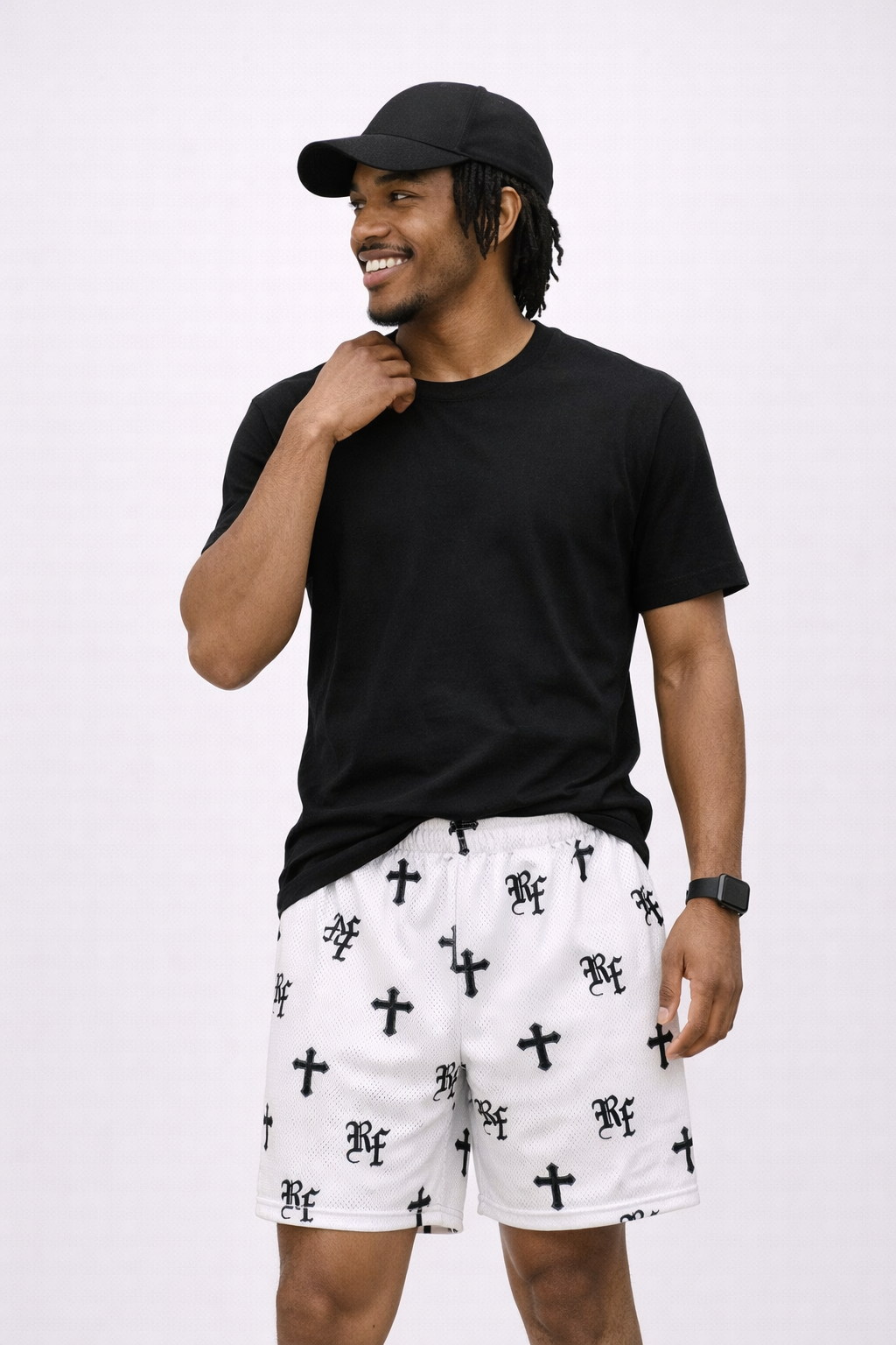 Man wearing a black t-shirt and baseball cap and RF-Wear Men's Mesh Cross Shorts in White