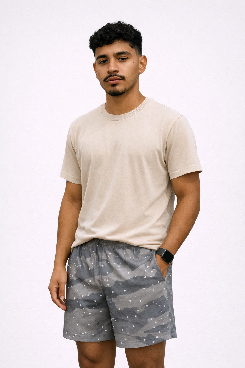 Man wearing a t-shirt and RF-Wear Men's Mesh Desert Camo Shorts in Grey 