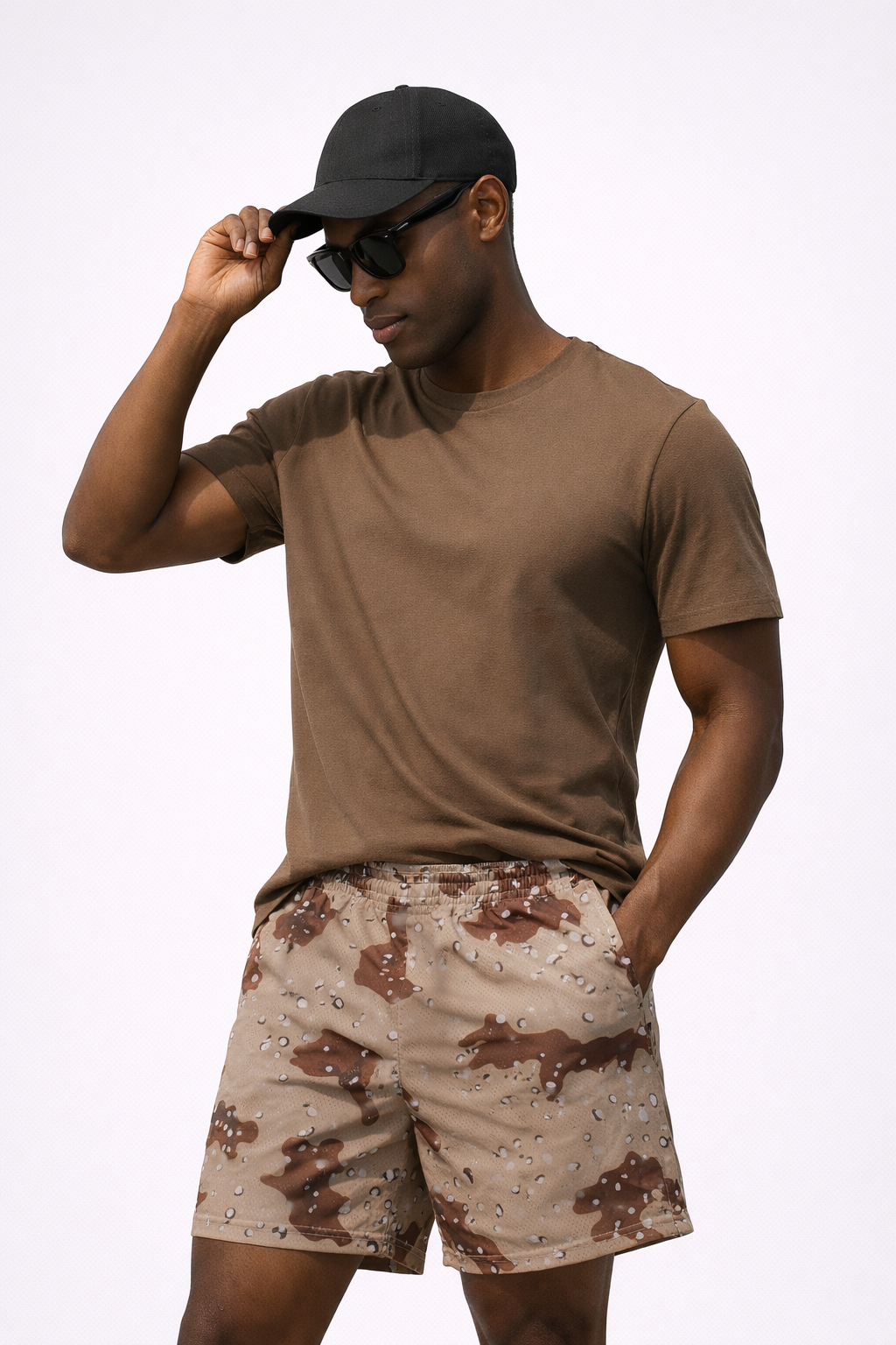 Man wearing  brown t-shirt and RF-Wear Men's Mesh Desert Camo Shorts in Tan/Brown 