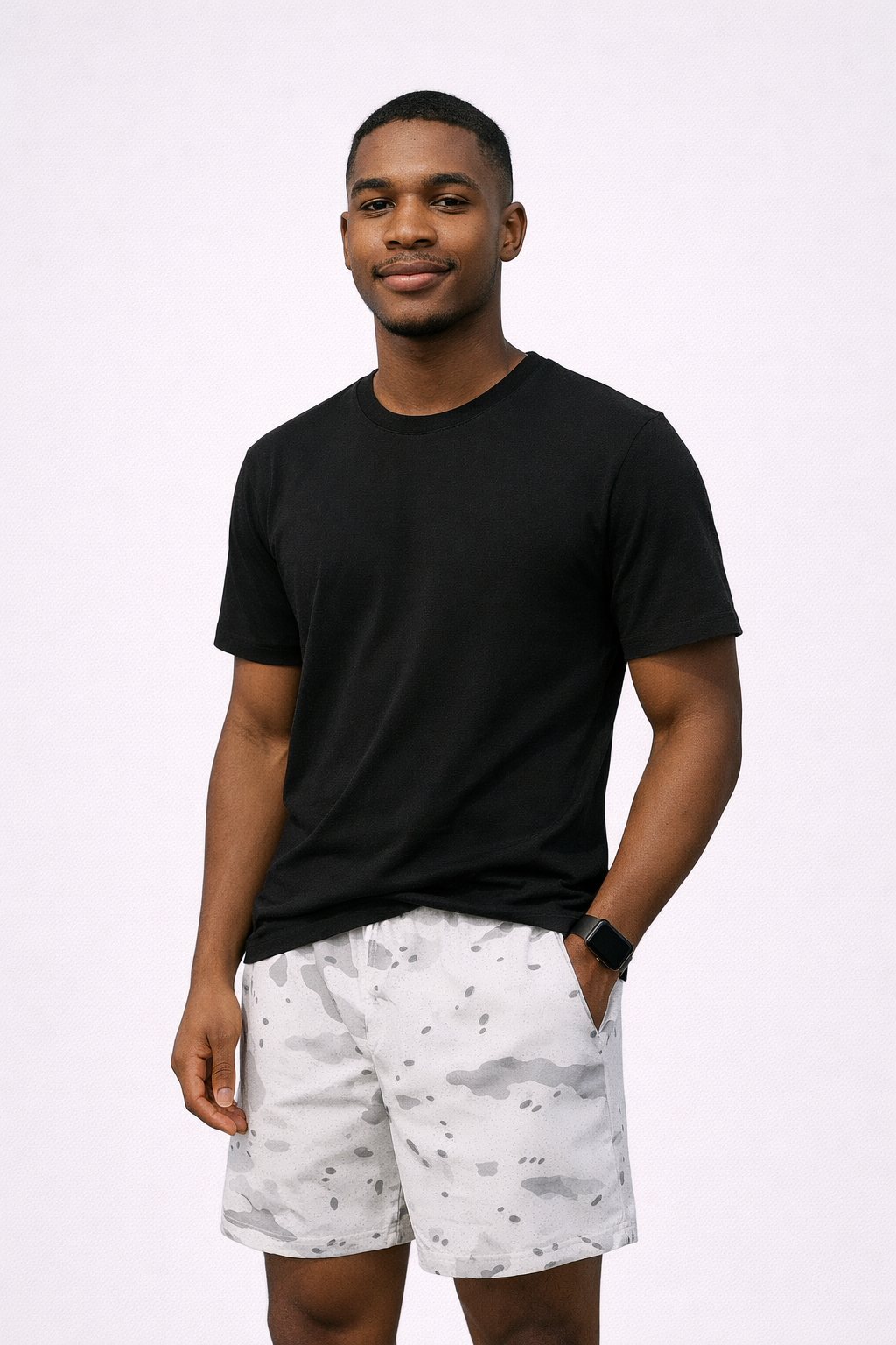 Man wearing a black t-shirt and RF-Wear Men's Mesh Desert Camo Shorts in White 