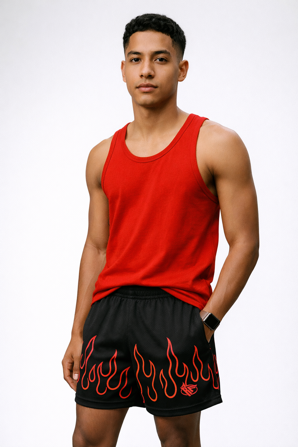 Man wearing a red tank top and RF-Wear Men's Mesh Fire Shorts in Black/Red