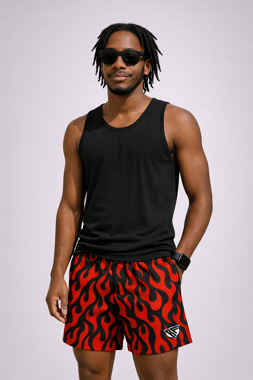 Man wearing a black tank top and RF-Wear Men's Mesh Flame Shorts in Black/Red