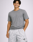 Man wearing a short sleeve grey top and RF-Wear Men's Mesh Flame Shorts in White/Grey
