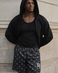 Man wearing a black hoodie and RF-Wear Men's Mesh Gothic Cross Shorts in Black/Grey