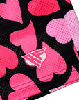 Close up of RF-Wear Men's Mesh Heart Shorts - Black/Pink with logo