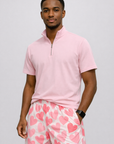 Man wearing a short sleeve quarter zip and RF-Wear Men's Mesh Heart Shorts in White/Pink