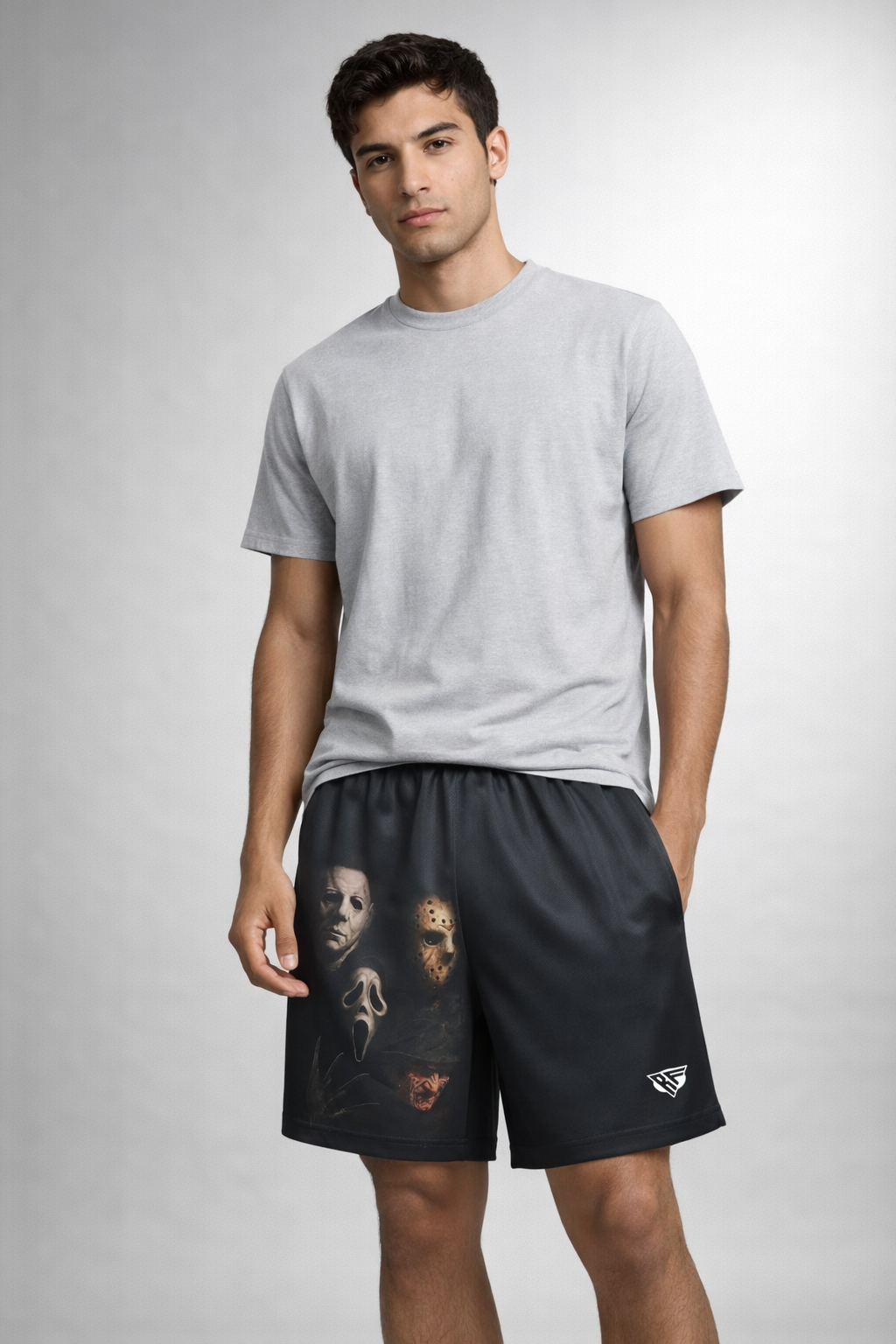 Man wearing a grey top and RF-Wear Men's Mesh Horror Squad Shorts in Black