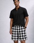 Man wearing a black short sleeve quarter zip top and RF-Wear Men's Mesh Houndstooth Shorts in Black/White 