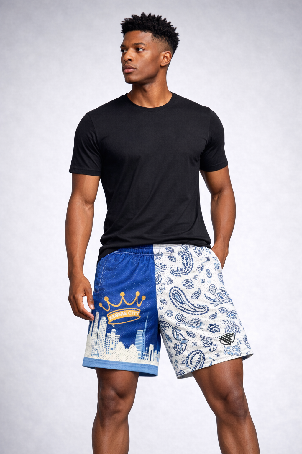 Man wearing a black t-shirt and RF-Wear Men's Mesh Kansas City Cityscape Shorts in Blue/White