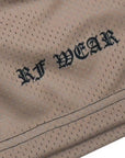 Close-up of RF-Wear Men's Mesh Mary Shorts in Tan with RF WEAR logo