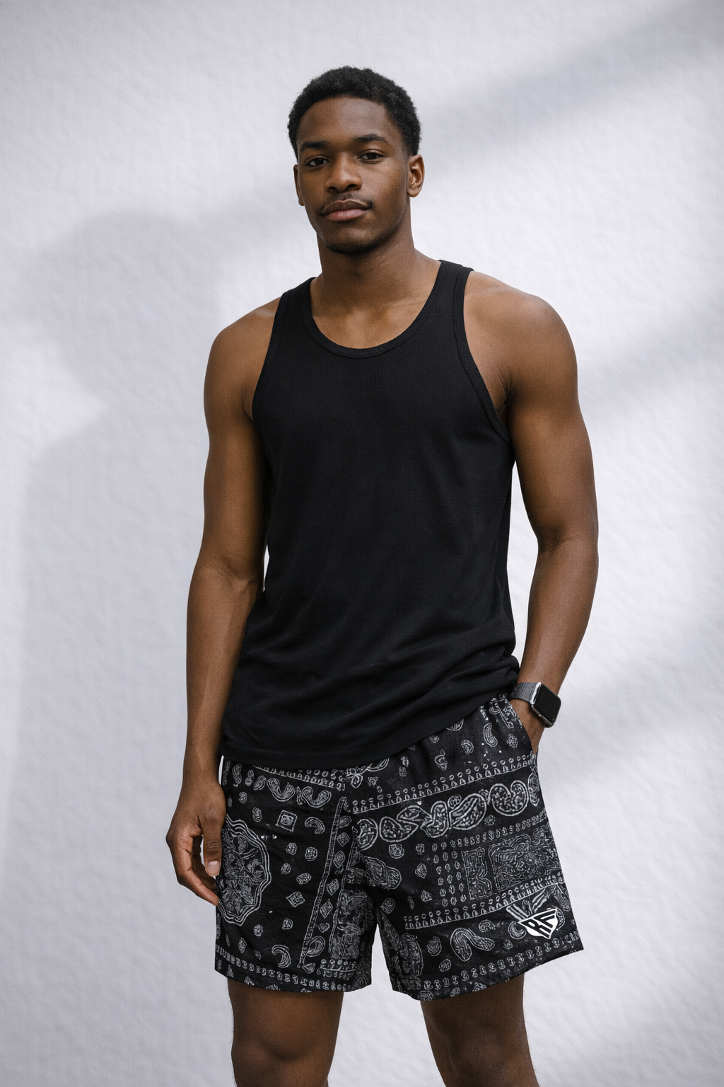 Man wearing a black tank top and RF-Wear Men's Mesh Mismatch Bandana Shorts in  Black