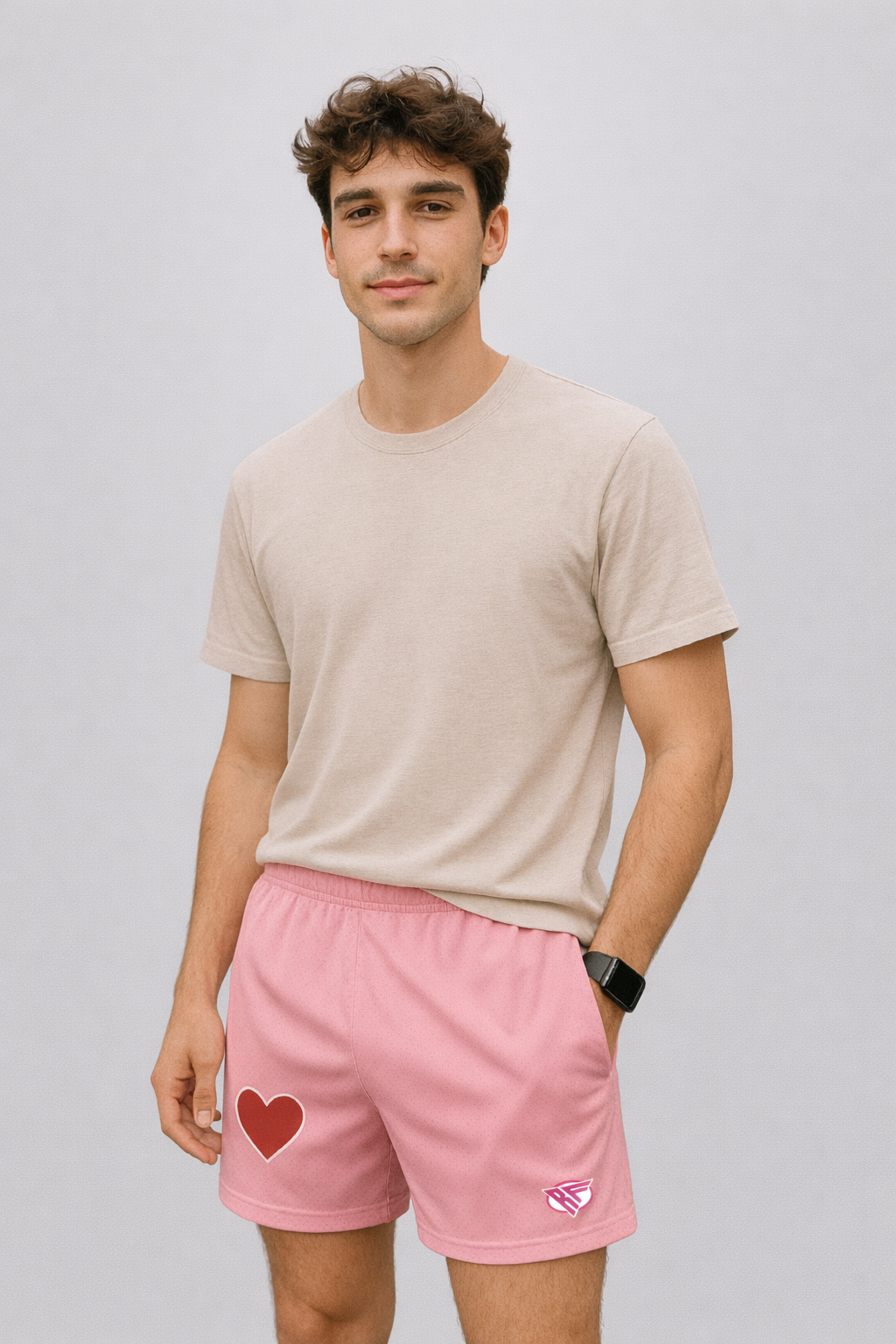 man wearing a t-shirt and RF-Wear Men's Mesh One Heart Shorts in Pink