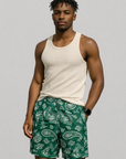 Man wearing a tank top and RF-Wear Men's Mesh Paisley Shorts in Green/White 