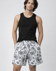 Man wearing a black tank top and RF-Wear Men's Mesh Paisley Shorts in White/Black 