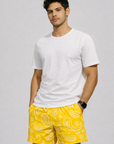 Man wearing a white t-shirt and RF-Wear Men's Mesh Paisley Shorts in Yellow/White