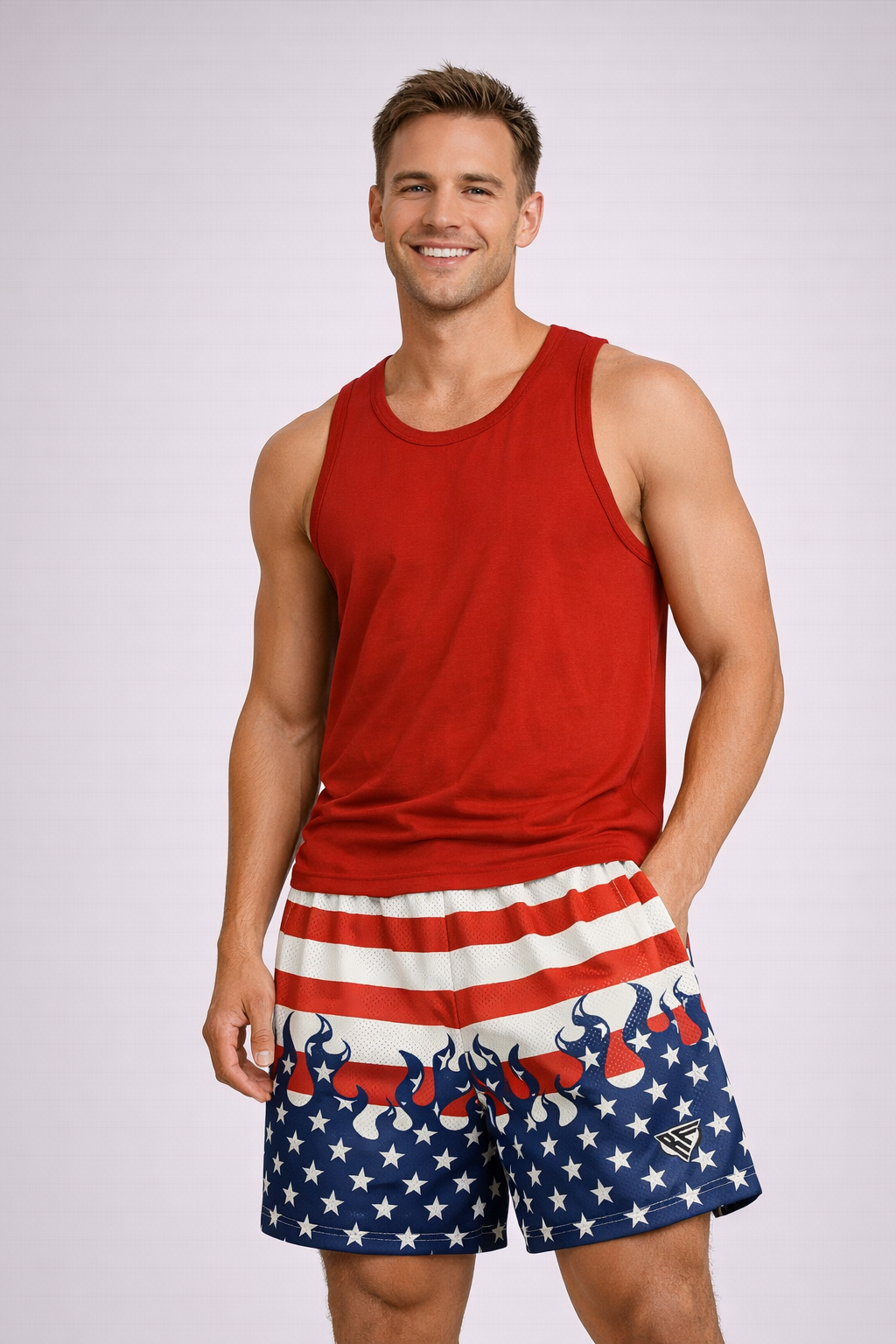 Man wearing a red tank top and RF-Wear Men's Mesh Patriotic Flame Shorts in Red/White/Blue