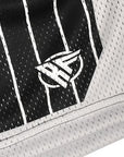 Close-up of RF-Wear Men's Mesh Pinstripe Basketball Shorts in Black/White with RF logo