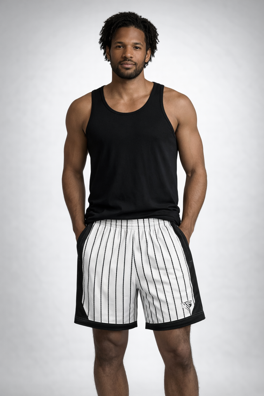 Man wearing a black tank top and RF-Wear Men's Mesh Pinstripe Basketball Shorts in White/Black