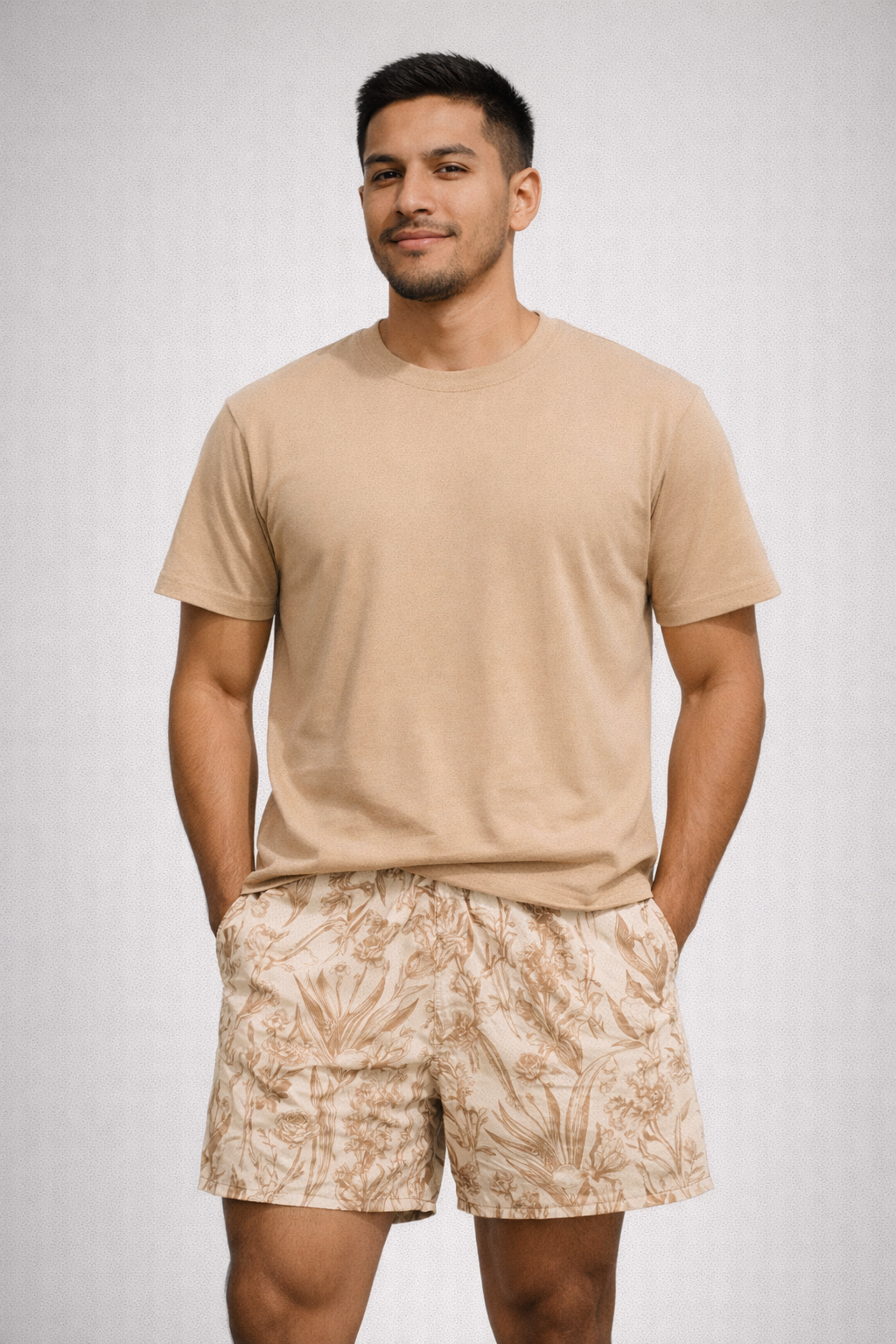 Man wearing a tan t-shirt and RF-Wear Men's Mesh Floral Porcelain Shorts in Cream/Tan 