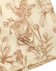Close-up of RF-Wear Men's Mesh Floral Porcelain Shorts in Cream/Tan  with RF logo