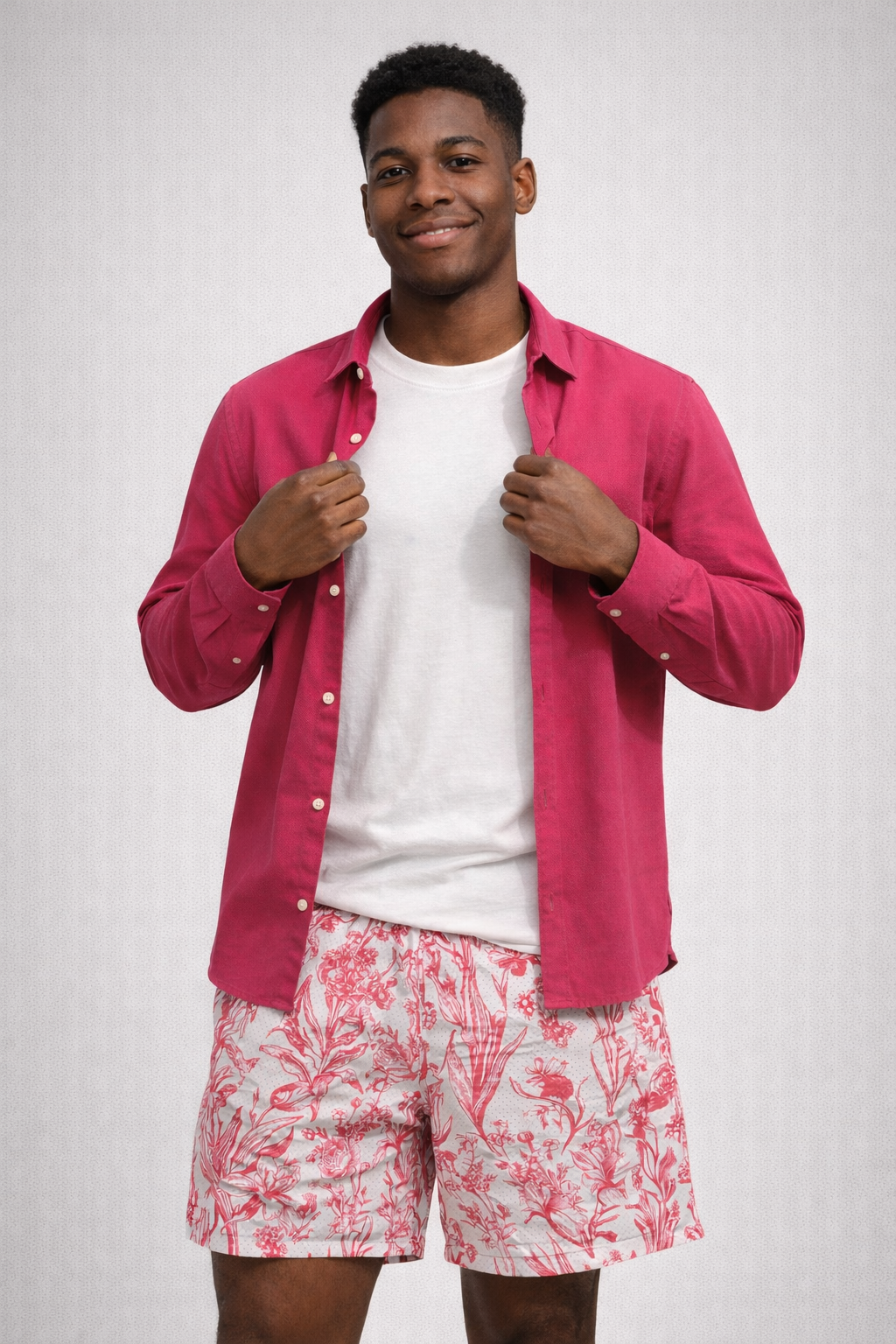 man wearing a white t-shirt and RF-Wear Men's Mesh Floral Porcelain Shorts in White/ Fuchsia