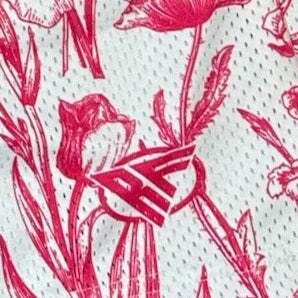 Close-up of RF-Wear Men's Mesh Floral Porcelain Shorts in White/ Fuchsia with RF logo