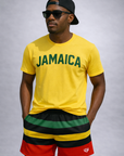 Man wearing a yellow t-shirt with JAMAICA written on the front and RF-Wear Men's Mesh Rasta Shorts in multicolors
