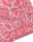 Close-up of RF-Wear Men's Mesh Floral Rose Shorts in Pink with RF logo