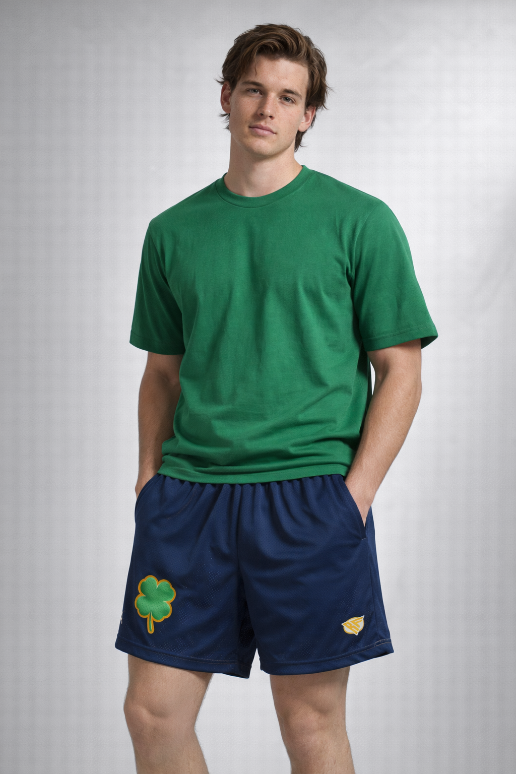 Man wearing a green t-shirt and RF-Wear Men's Mesh Shamrock Shorts in  Navy