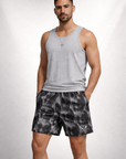 Man wearing a grey tank top and RF-Wear Men's Mesh Skull Shorts  in Black/Grey 