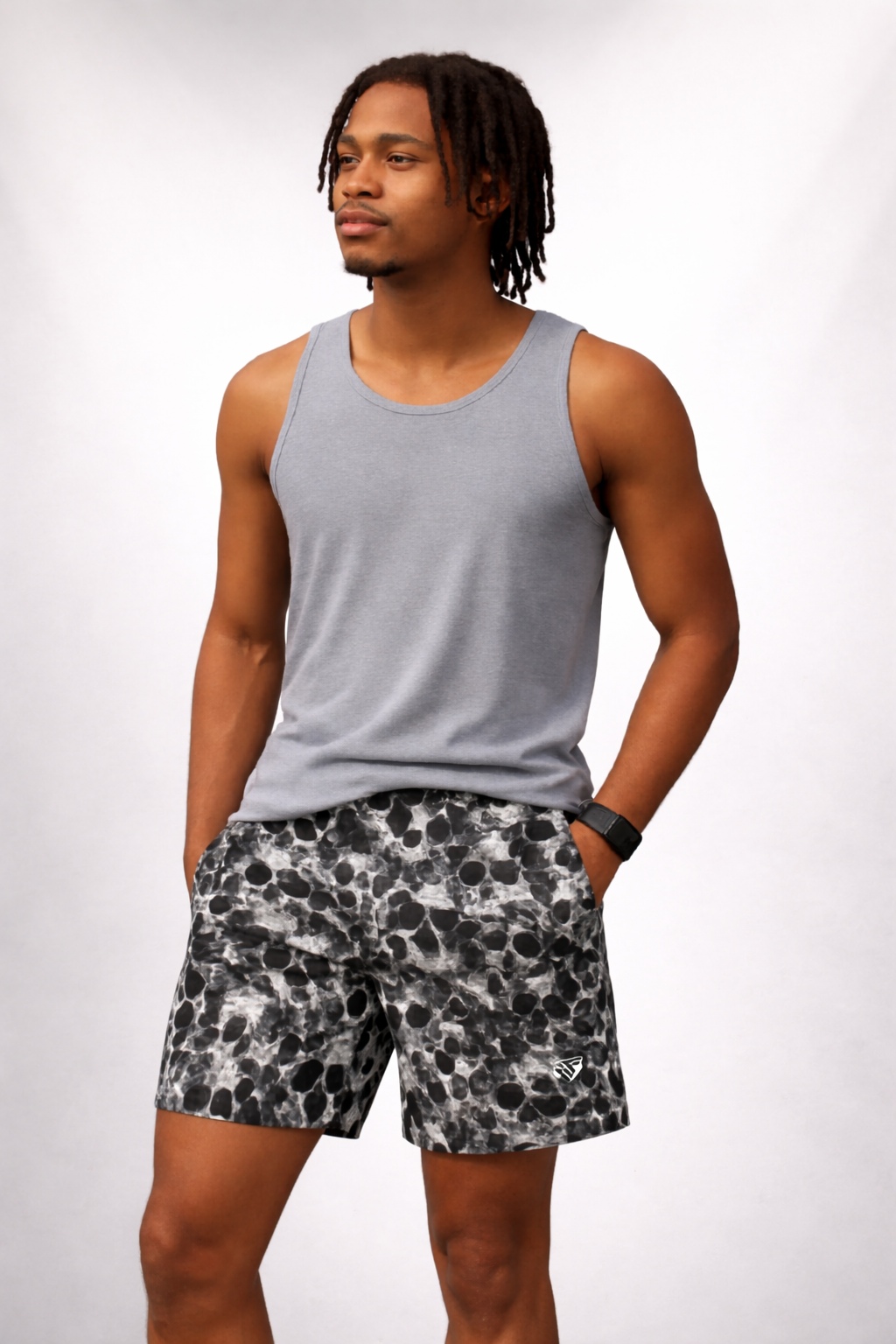 Man wearing a grey tank top and RF-Wear Men's Mesh Skull Shorts in Black/White 
