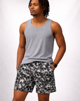 Man wearing a grey tank top and RF-Wear Men's Mesh Skull Shorts in Black/White 