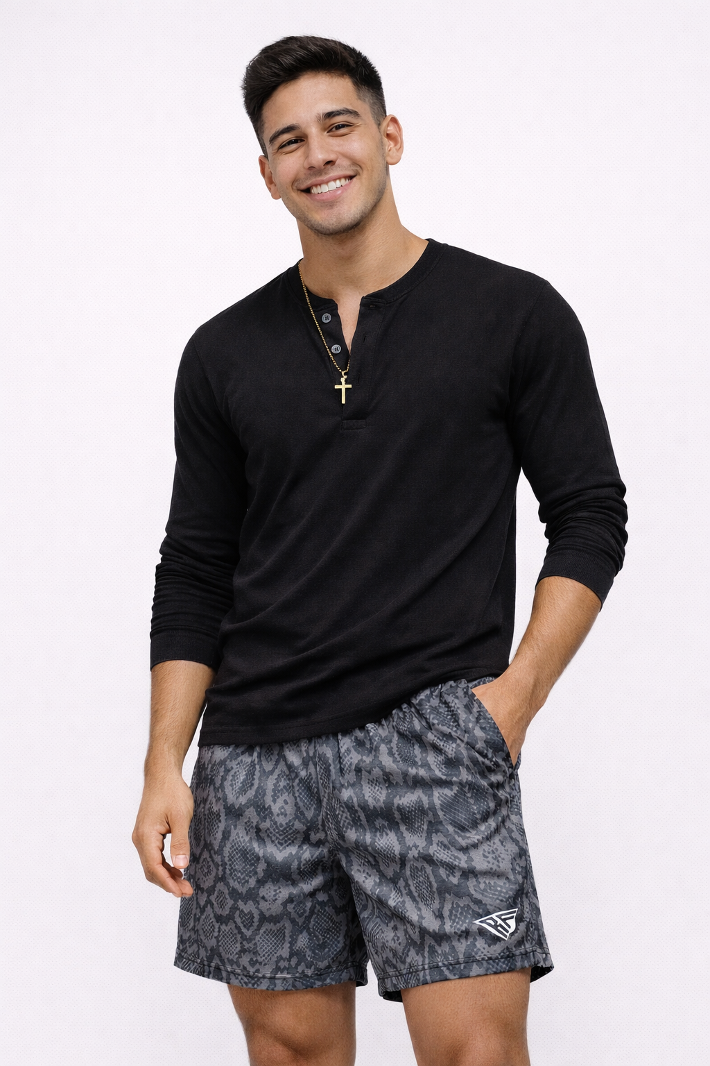 Man wearing a black top and RF-Wear Men's Mesh Snakeskin Shorts in Black