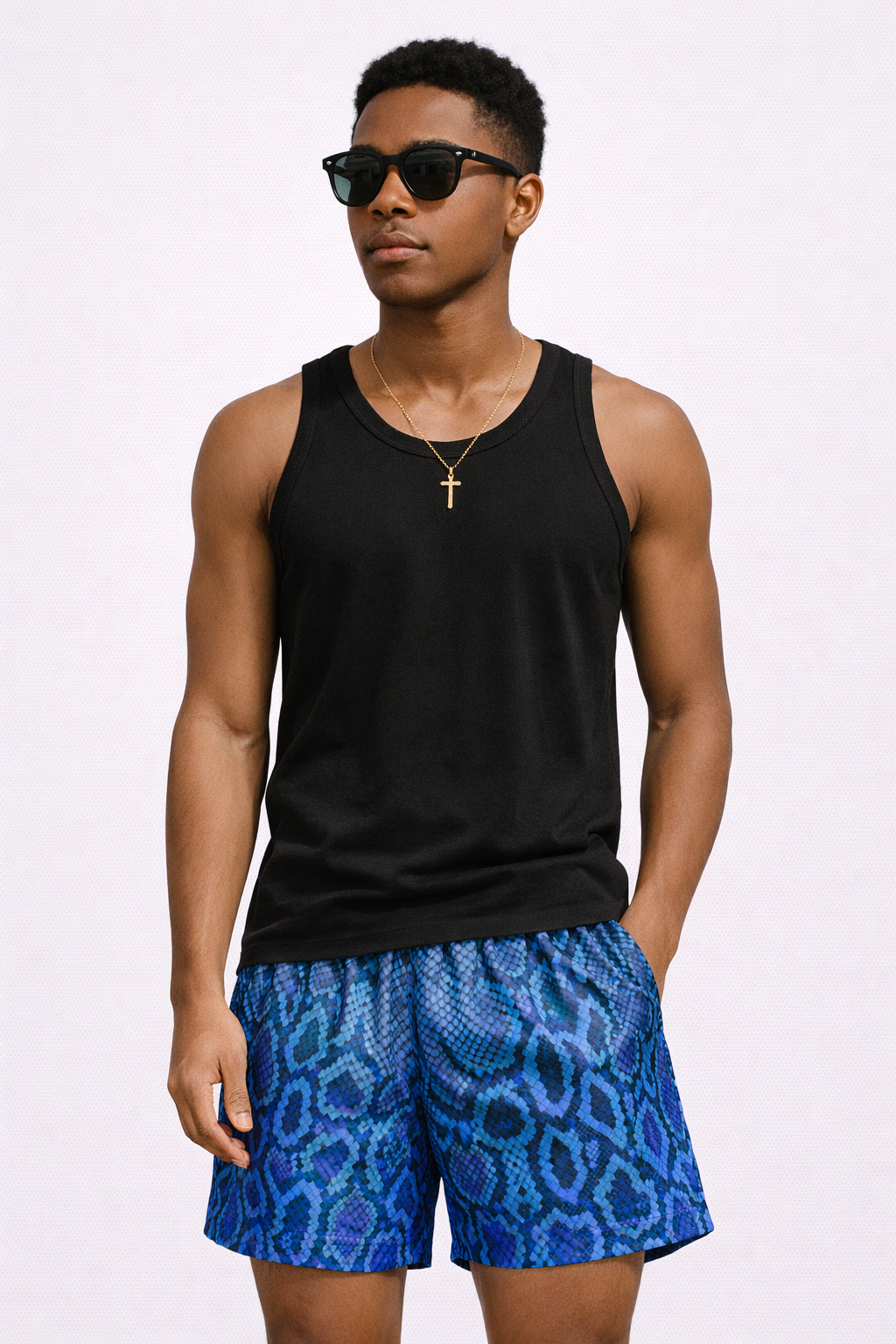 Man wearing a black tank top and RF-Wear Men's Mesh Snakeskin Shorts in Blue
