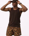 Man wearing a brown tank top and cap, and RF-Wear  Men's Mesh Snakeskin Shorts in Brown