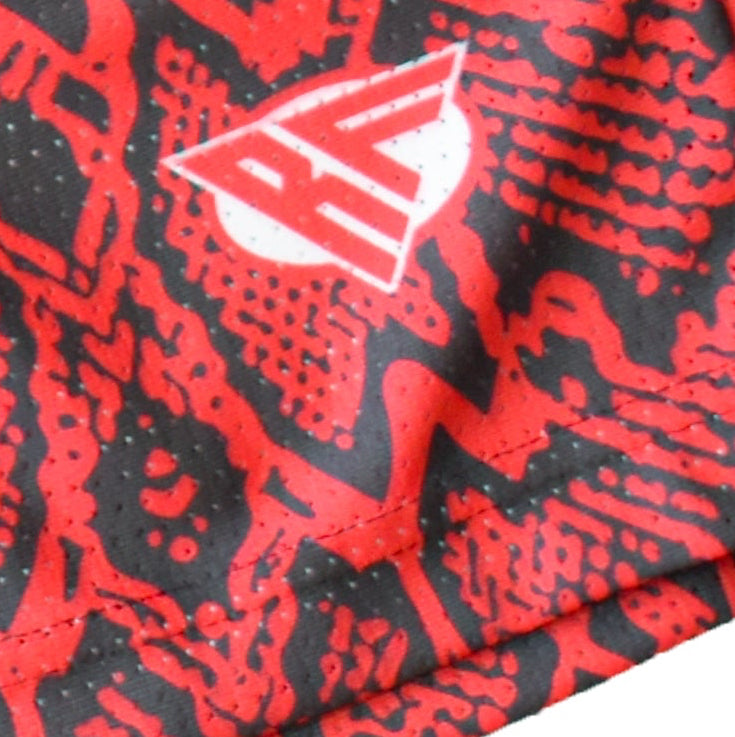 Close-up of RF-Wear Men's Mesh Snakeskin Shorts in Red with RF logo