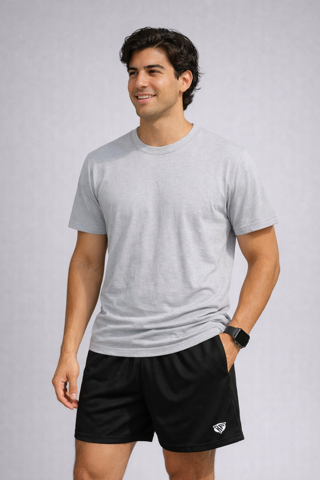 Man Wearing a grey t-shirt and RF-Wear Men's Mesh Solid Color Shorts in Black