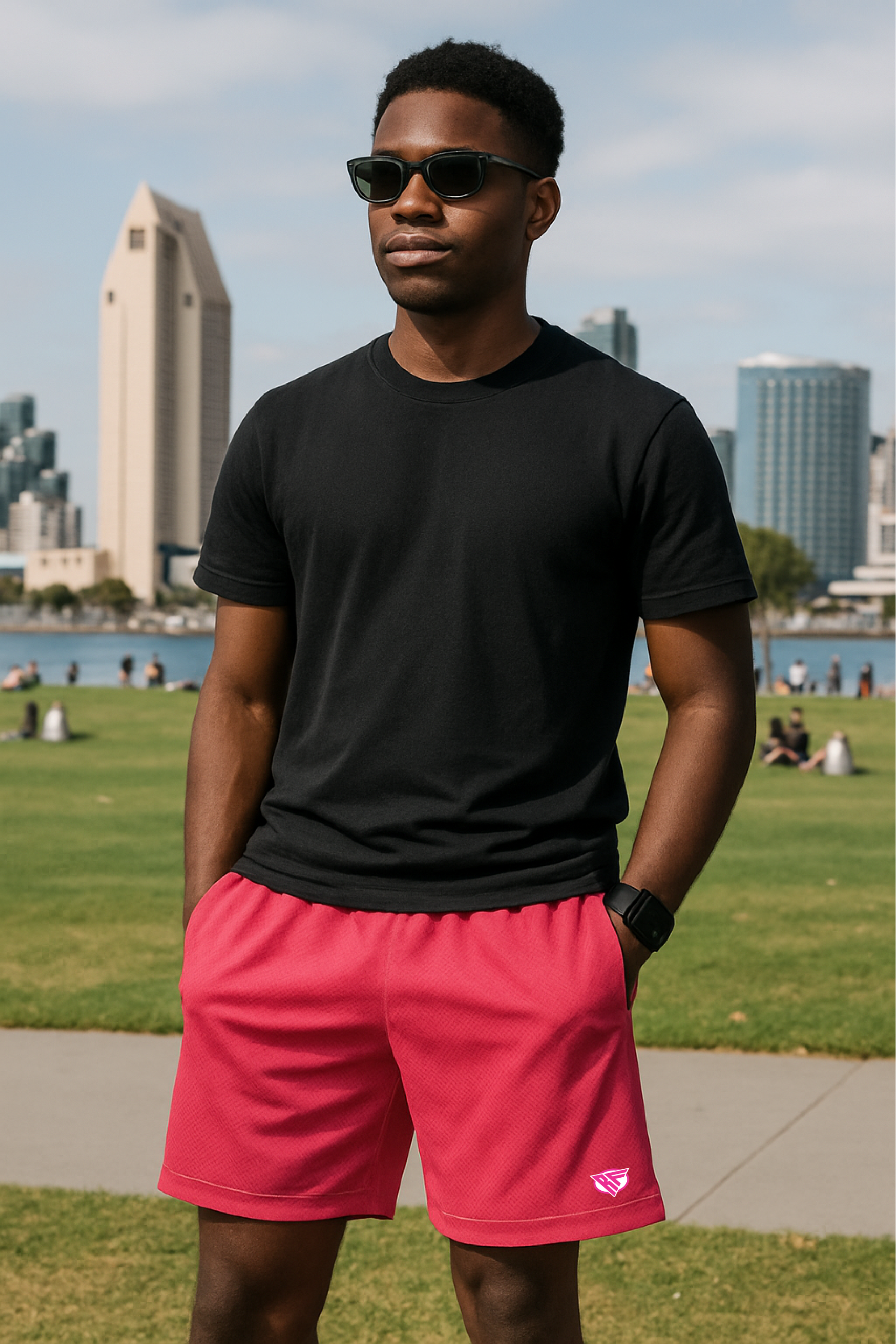 Man wearing a black t-shirt and RF-Wear Men's Mesh Solid Color Shorts in Fuchsia 