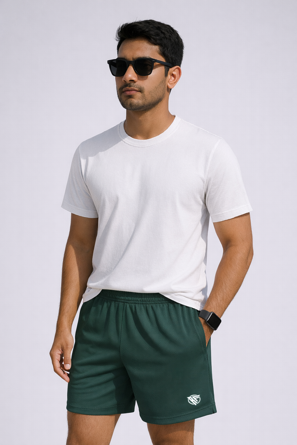 Man wearing a short sleeve t-shirt and RF-Wear Men's Mesh Solid Color Shorts in Military-Green
