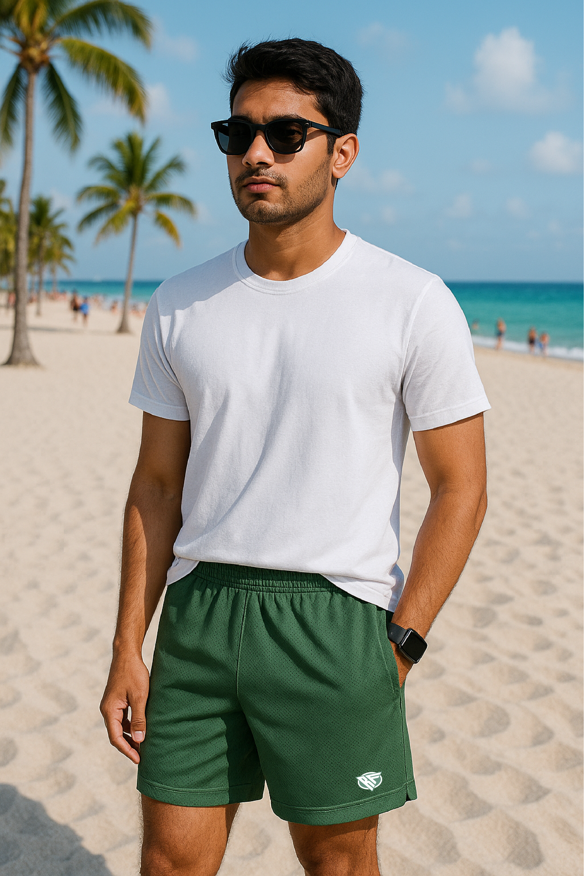 Man on beach wearing a white t-shirt and RF-Wear Men's Mesh Solid Color Shorts in Military-Green 